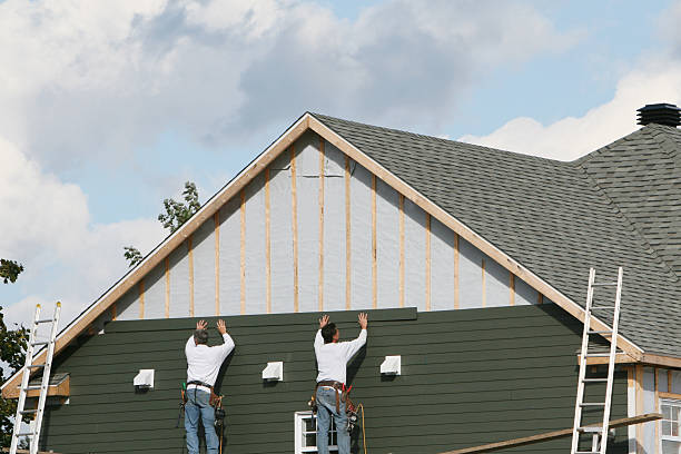 Professional Storm Damage Siding Repair technician working in Danville, IN